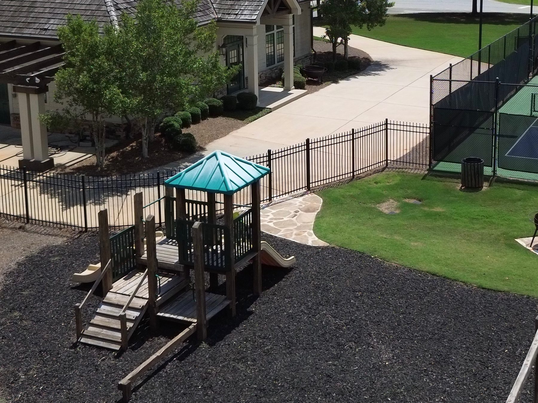 Fenced community playground near the recreation facilities